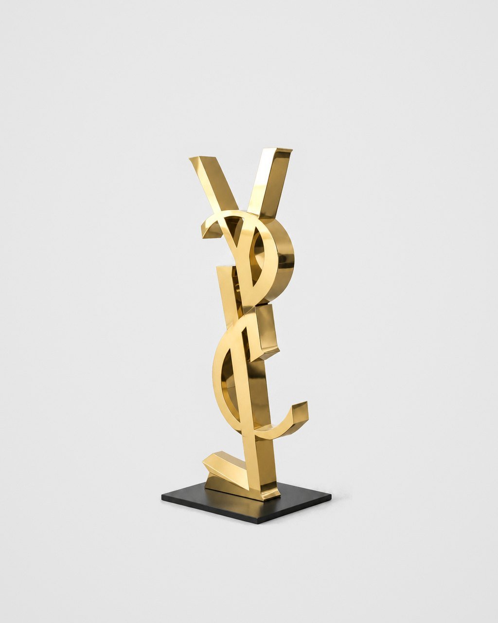 Monogram sculpture, mirror gold