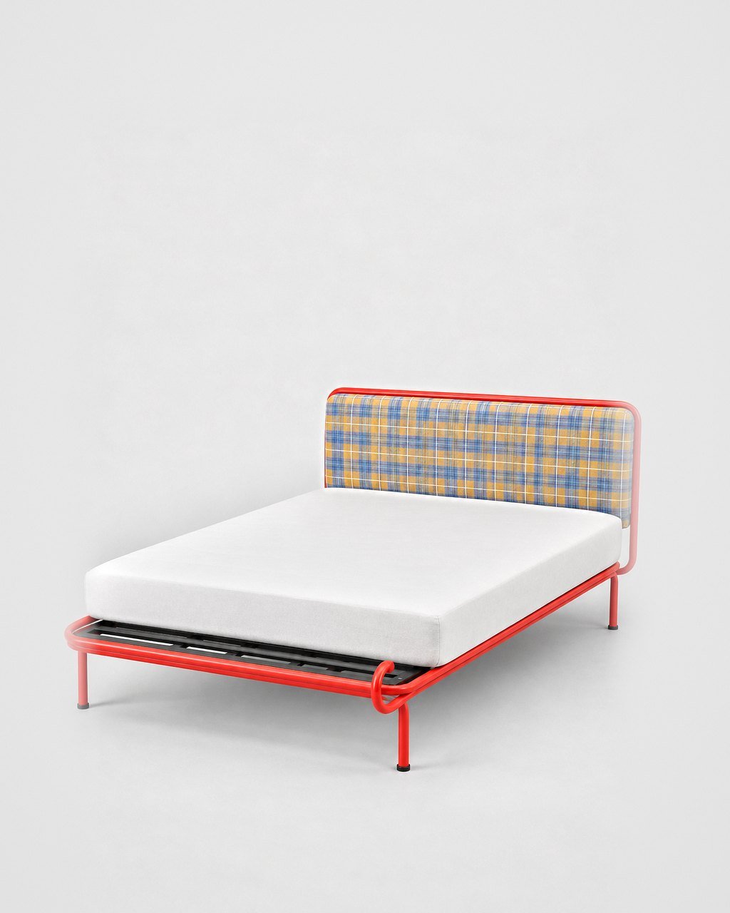 Tube bed with plaid headboard