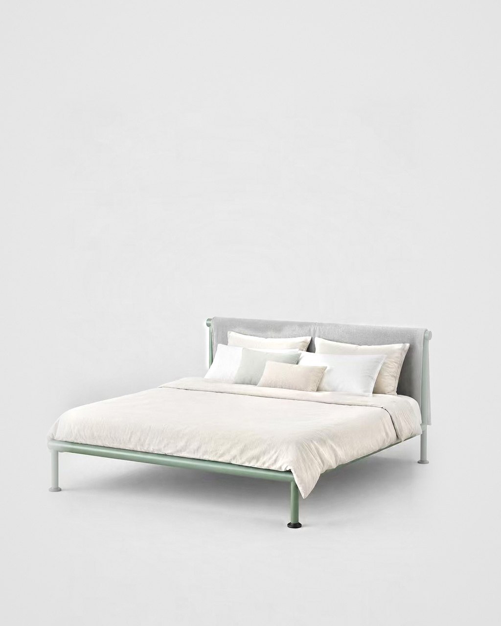 Tube bed with upholstered headboard
